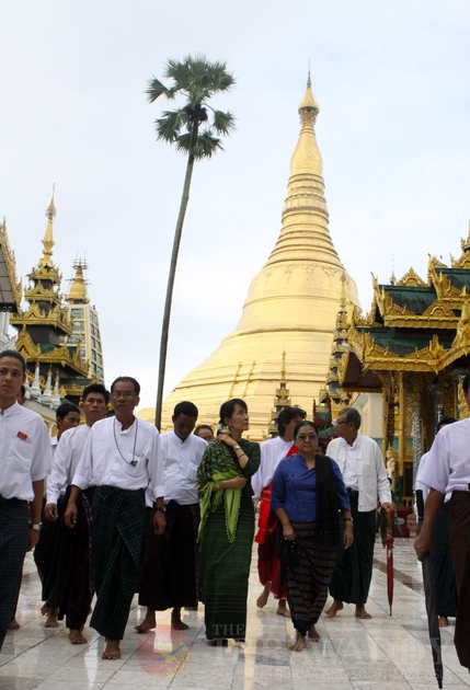 Myanmar Democracy leader Aung San Suu Kyi and her youngest son Kim Aris visit Shwedagon Pagoda on Tuesday, 12 July, 2011, Yangon Myanmar.