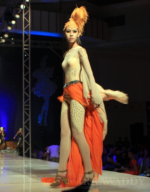 A Myanmar model presents dresses created by a local designer during 1st Myanmar Fashion Designer Group's Fashion Phenomenon at Myanmar Convention Center (MCC) Saturday, Oct. 1, 2011, in Yangon, Myanmar A Myanmar model presents dresses created by a local designer during 1st Myanmar Fashion Designer Group's Fashion Phenomenon at Myanmar Convention Center (MCC) Saturday, Oct. 1, 2011, in Yangon, Myanmar
