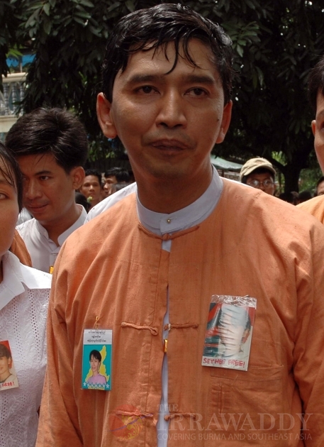 Min Ko Naing, a student activist leader, stands outside head office of the Myanmar's democracy leader Aung San Suu Kyi's National League for Democracy party in Yangon, Myanmar. A Myanmar official says authorities have begun transferring some political pri