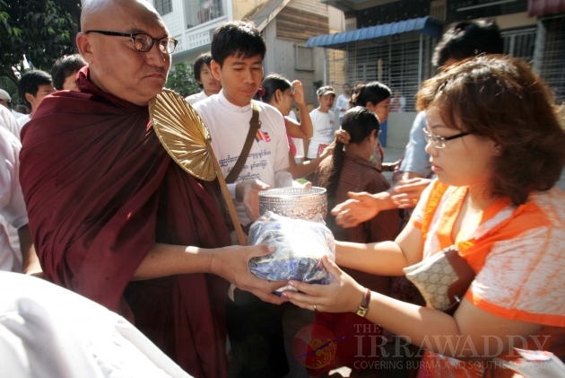 Shwe Nya War Sayadaw going around to accept the offering, 15 Feb 2012, Myanmar.