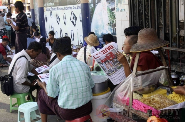 Publics follow up the news in Rangoon, Burma.
