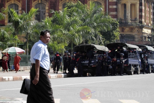 The trucks of riot polices parking at the City Hall tighten security near the polling station, in Rangoon, Burma.