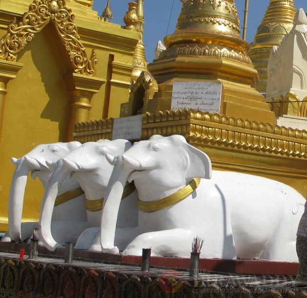 Three statues of white elephants locate at the world famous Shwedagon pagoda in Rangoon, Burma. Three statues of white elephants locate at the world famous Shwedagon pagoda in Rangoon, Burma.