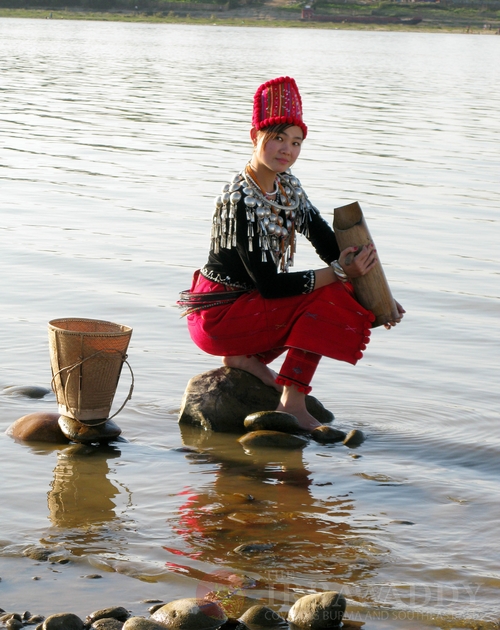 A Kachin girl fetches water from Myitson River.