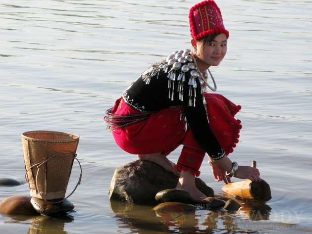 A Kachin girl fetches water from Myitson River.