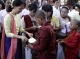 Novices receive donation of alms from NLD leader Aung San Suu Kyi in Rangoon, Burma.