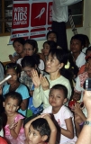 Burma pro-democracy leader Aung San Suu Kyi was among children on the World AIDS day.
