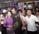 Kim Aris hug his mother Aung San Suu Kyi during visited at the Bogkyoke market in Yangon, Burma.