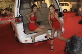 22-01-11 Burmese models pose with locally made autos during Myanmar Auto and Auto Parts Expo in Rangoon, Burma.