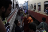 Vendors sell snacks to passengers as a train stop at railway station in Myitkyina, Kachin State, about 1,600 km (1,000 miles) north of Rangoon, Burma.