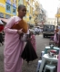 Nuns are asking for alms at the shop in Rangoon, Burma.