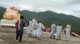 Monks walk past the statue which was destroyed by the earthquake in Tarlay, Easter Shan State, Burma.