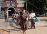 Prisoners walk out the Burma's Insein Prison after they are released as the new government cut one year from their prison terms under a &quot;general amnesty&quot; programmed in Rangoon, Burma.