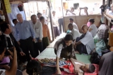 U.S. Senator John McCanin visits the shelter for AIDS patients run Phyu Phyu Thin, Burma's well-known AIDS activist in Rangoon, Burma.