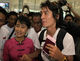 Burma pro-democracy leader Aung San Suu Kyi fetches her younger son, Kim Aris, at Yangon International Airport in Rangoon, Burma.