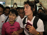 Burma pro-democracy leader Aung San Suu Kyi fetches her younger son, Kim Aris, at Yangon International Airport in Rangoon, Burma.