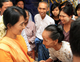 05-11-11 Myanmar democracy leader Aung San Suu kyi greets a Myanmar aged woman during visiting to pagoda along with her youngest son Kim Aris at Bagan, Myanmar