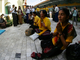 Myanmar activits gather to pray at Sule Pagoda on fourth anniversary of the Buddhist monks protest Monday, September 26, 2011, in Yangon, Myanmar. Security tighten in towndown of Yangon.