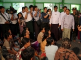 Aung San Suu kyi visit fire victims today Friday, Dec.30, 2011, in Yangon, Myanmar
