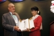 Myanmar opposition leader Aung San Suu Kyi, right, receives a posthumous gift from a Foreign minister of Czech Republic, Karel Schwarzenberg, left, during their meeting at Thingaha hotel in Naypyitaw, Myanmar, Tuesday, July 17, 2012.