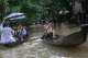 People making their ways with boat on 6th August as the houses from some wards in Bago Region were floated due the heavy rain and unusual tide.