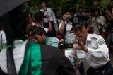 A Security officer taking record of the demonstration made by the students in the Dagon University Compound on 2nd September. (Photo – Sai Zaw/ Irrawaddy)