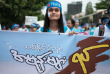 A peace-wisher taking part in marching ceremony celebrated in Yangon to honor the International Peace Day which falls on 21st September. (Photo – Sai Zaw/ Irrawaddy)