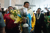 Khin Maung Lwin, Myanmar National Football Team's Captain arrived at the Yangon International Airport with Philippines Peace Cup on 8th September. Myanmar got a draw result when playing against the Philippines National Team at their home. Myanmar National Team became Champion with Soe Min Oo, the substitute player scored a goal during the extra time. (Photo – Sai Zaw/ Irrawaddy)