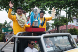 The Team Captain Khin Maung Lwin, the Striker Kyaw Ko Ko and the Philippines Peace Cup on the vehicle that would go around the Yangon City celebrate the victory. Myanmar got a draw result when playing against the Philippines National Team at their home. Myanmar National Team became Champion with Soe Min Oo, the substitute player scored a goal during the extra time. (Photo – Sai Zaw/ Irrawaddy)