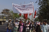 17-02-15 - PHOTO Sai Zaw Workers from Shwe Pyi Thar industrial zone demonstrate for improved wages and labour rights on the morning of Feb 17. Hundreds of labourers  walked from Shwe Pyi Thar to Insein T/ship ,led by the workers strike committee. Although their initial plan was to walk to the front of the divisional government office, workers temporarily stopped their walk after negotiation with government officials and employers.