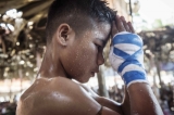 Shwe Pharsi prays before entering the ring, February 2015. (Photo: Timo Jaworr / The Irrawaddy)