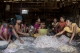 Women prepare freshly caught fish to sell in Andin. (Photo: Tin Htet Paing / The Irrawaddy)