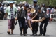 Police forcibly detain labor rights protestors
