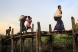 Dozens of Maungdaw residents flee their homes in rural Maungdaw Township to Arakan State capital Sittwe on Oct 14,2016.