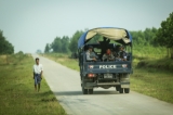 Myanmar police force travel in trucks through Maungdaw, located in Rakhine State, on Oct 17, 2016.