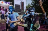 Holi festival celebrations on Wednesday saw hundreds join the colorful fun at Kawdawgyi Park, Yangon. At this annual Hindu spring festival, festival-goers enjoy throwing colored powder and dancing to music. (Photos: Aung Kyaw Htet / The Irrawaddy)