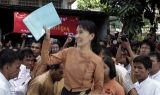 Aung San Suu Kyi among the media on the National Day in front of the NLD headquarters in Rangoon, Burma.