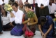 Burma pro-democracy leader Aung San Suu Kyi and her youngest son Kim Aris pay homage to Buddha at Shwedagon Pagoda in Rangoon, Burma.