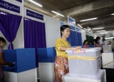 Voters pratice to put their ballot in the box for election.