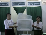 Two teachers volunteer showed the ballot box to proof.