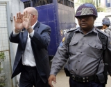 Ross Dunkley, editor of the Myanmar time’s journal, is seen outside the Kamayut township court before hearing at the court Tuesday, in Rangoon, Burma. The court will hear his appeal at 17 March, 2011.