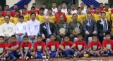 The chief of FIFA Seep Blatter (centre), take a group photo with football team and ministers in Mandalay, Burma.