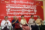 10-05-11 - Photo:- Irrawaddy Family members of political prisoners and Burma pro-democracy leader Aung San Suu Kyi attend a ceremony to donate cash at NLD party's headquarters in Rangoon, Burma.