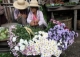 Vendors sell flowers at local market in Nyaung Tone, Burma Irrawaddy Delta, about 60 miles southwest of Rangoon, Burma.