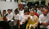 Political prisoners attend the welcoming ceremony and paper reading session on elections conducted by National League for Democracy party (NLD) at the headquarters in Rangoon, Burma.