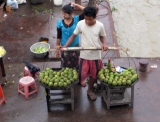 Vendors sell mangoes at a jetty in Dala Township in Rangoon, Burma.