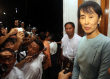 Burma pro-democracy leader Aung San Suu Kyi speaks to journalists after meeting  with Mr. Robert Cooper, Director-General, General Secretariat of the Council of the European Union, External Economic Relations, Politico-Military Affairs, at her home in Rangoon, Burma.