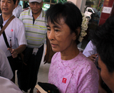 Myanmar democracy leader Aung San Suu Kyi arrives at Nyaung Oo Airport this morning  and she will stay at Bagan Hotel in Myanmar’s ancient historic city Bagan Myanmar on Monday, July.4, 2011. While she arrives at Bagan Hotel, she receives a flower from a hotel receptionist.