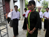 Myanmar Democracy leader Aung San Suu Kyi and her youngest son Kim Aris visit tomb of her mother Daw Khin Kyi, wife of General Aung San, Tuesday, 12 July, 2011, Yangon Myanmar.