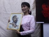Pro-democracy leader Aung San Suu Kyi attends art exhibition